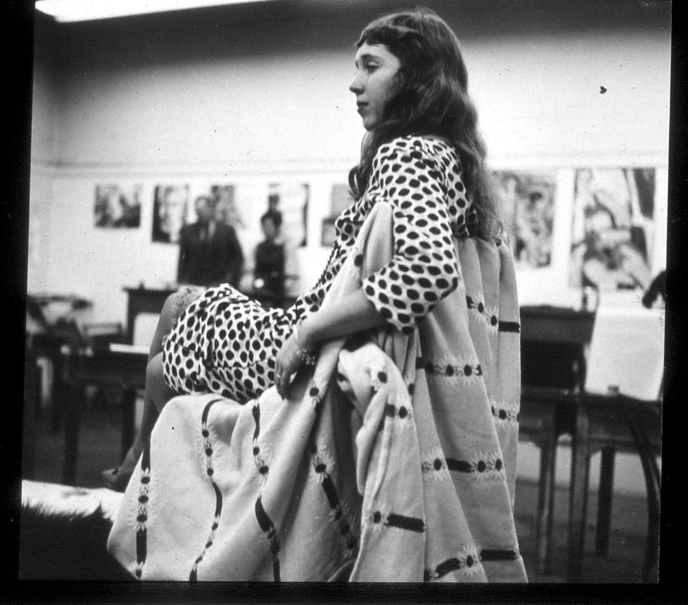 artist posing as a model in a studio class