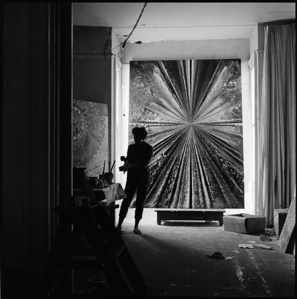 defeo working on a 10 foot panel of work in her studio